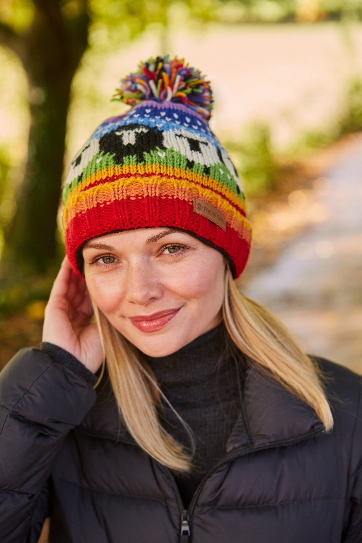 Pachamama Black Sheep Roll Back Bobble Beanie, Hand Knitted, Lined, Wool, Rainbow