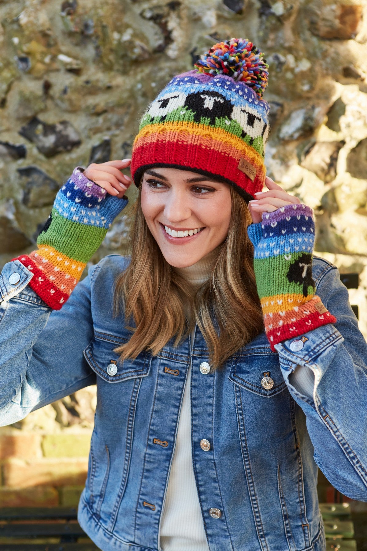 Pachamama Black Sheep Roll Back Bobble Beanie, Hand Knitted, Lined, Wool, Rainbow