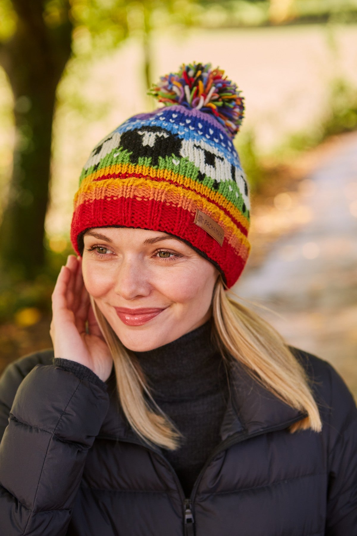 Pachamama Black Sheep Roll Back Bobble Beanie, Hand Knitted, Lined, Wool, Rainbow