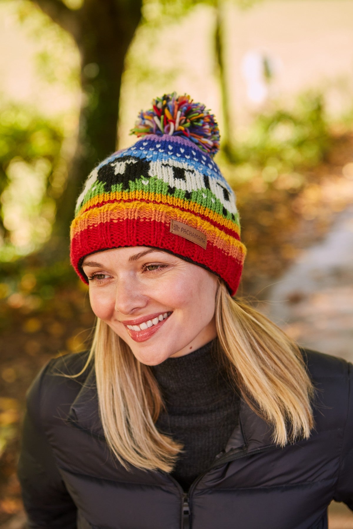 Pachamama Black Sheep Roll Back Bobble Beanie, Hand Knitted, Lined, Wool, Rainbow