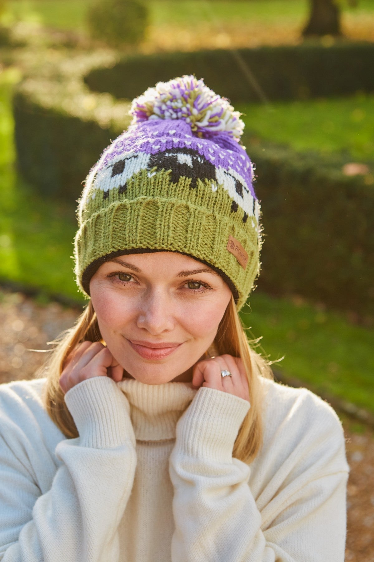 Pachamama Black Sheep Roll Back Bobble Beanie, Hand Knitted, Lined, Wool, Purple